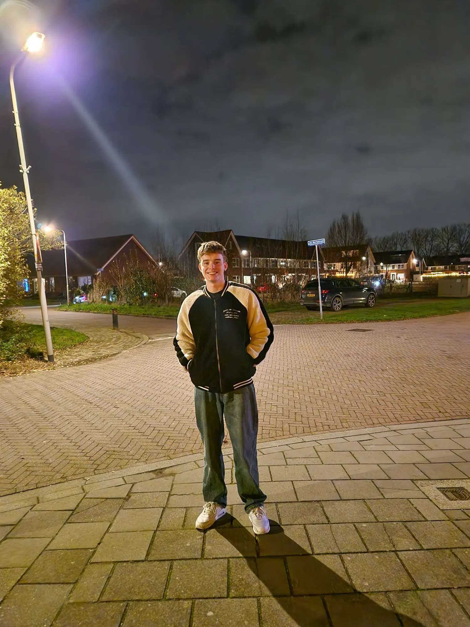 Guus outdoors at night